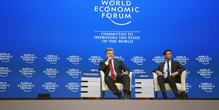 Jolanda Flubacher: DAVOS/SWITZERLAND, 21JAN15 - Petro Poroshenko, President of Ukraine and Philipp Roesler, Head of Centre for Regional Strategies, Member of the Managing Board, World Economic Forum; Young Global Leader are captured during the plenary session 'The Future of