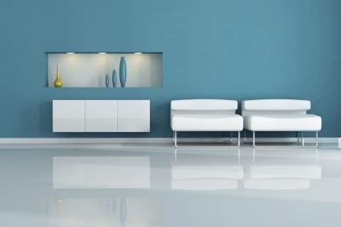 : two white armchair in a blue living room