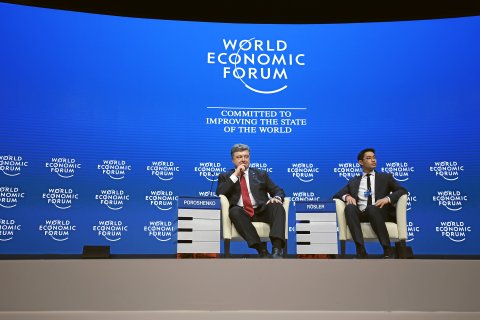 Jolanda Flubacher: DAVOS/SWITZERLAND, 21JAN15 - Petro Poroshenko, President of Ukraine and Philipp Roesler, Head of Centre for Regional Strategies, Member of the Managing Board, World Economic Forum; Young Global Leader are captured during the plenary session 'The Future of