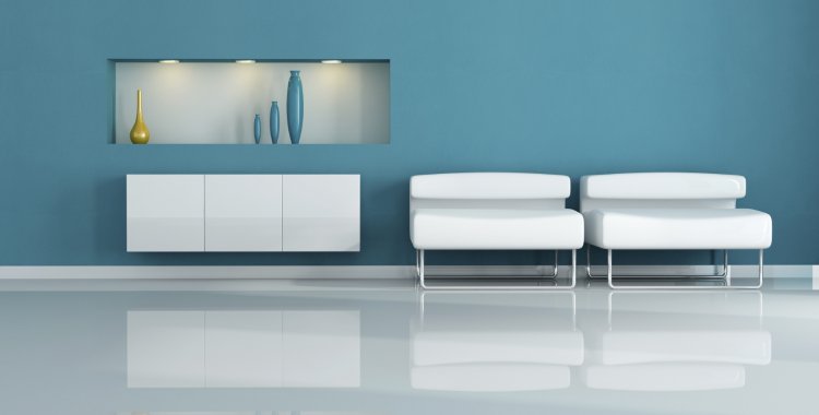 : two white armchair in a blue living room